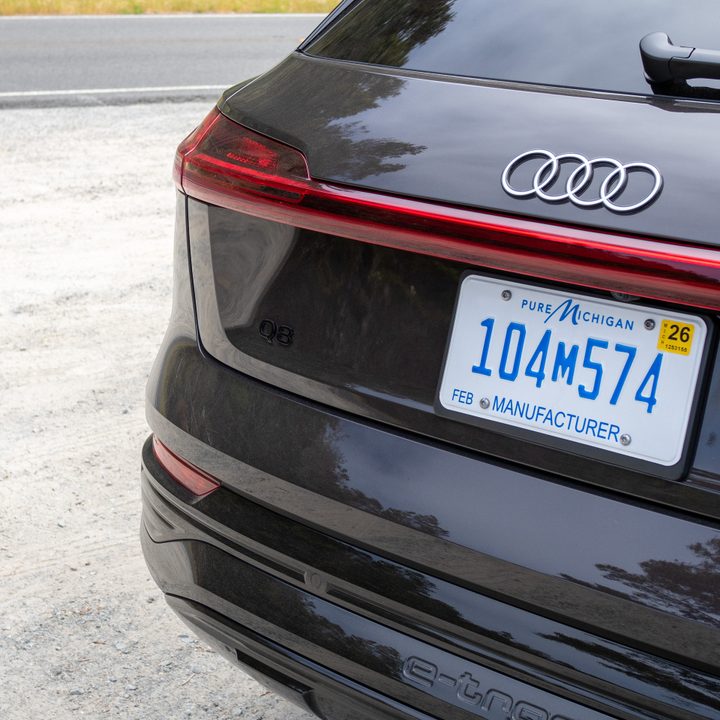 Audi Q8 e-tron in a dark brown color.