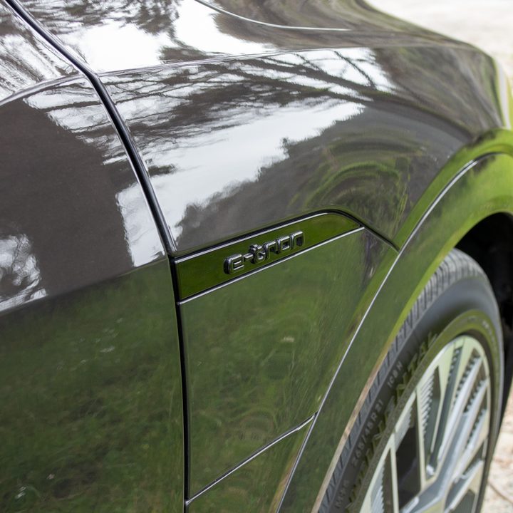Audi Q8 e-tron in a dark brown color.