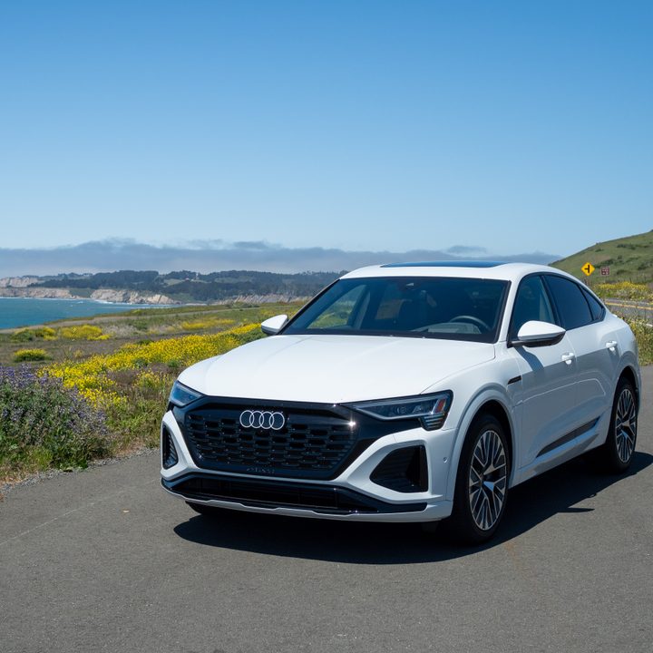 Audi Q8 e-tron sportback in white, parked on a road.