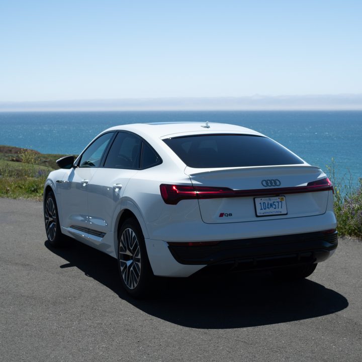 Audi Q8 e-tron sportback in white, parked on a road.
