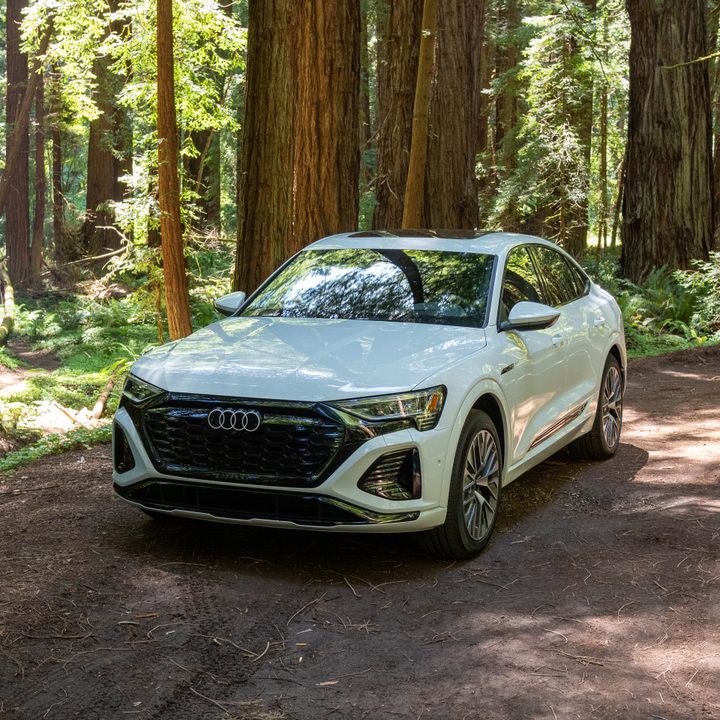 Audi Q8 e-tron sportback in white, parked on a road.