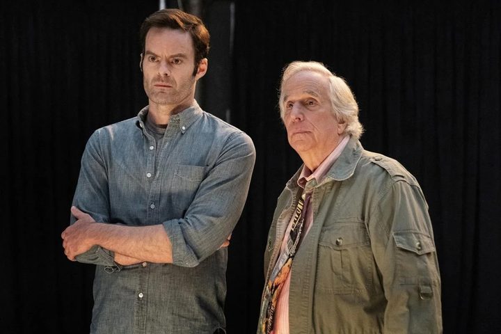 Barry and a man stand next to each other in Barry.
