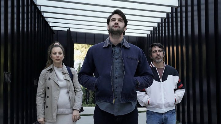 Ava, Matt, and Nathan standing in a garage of a wealthy homeowner in a scene from Based on a True Story.