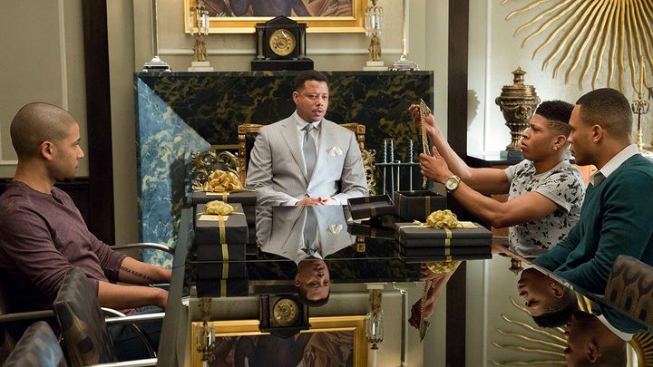 Lucious Lyon standing at the head of a table, his kids sitting around him in a scene from Empire.