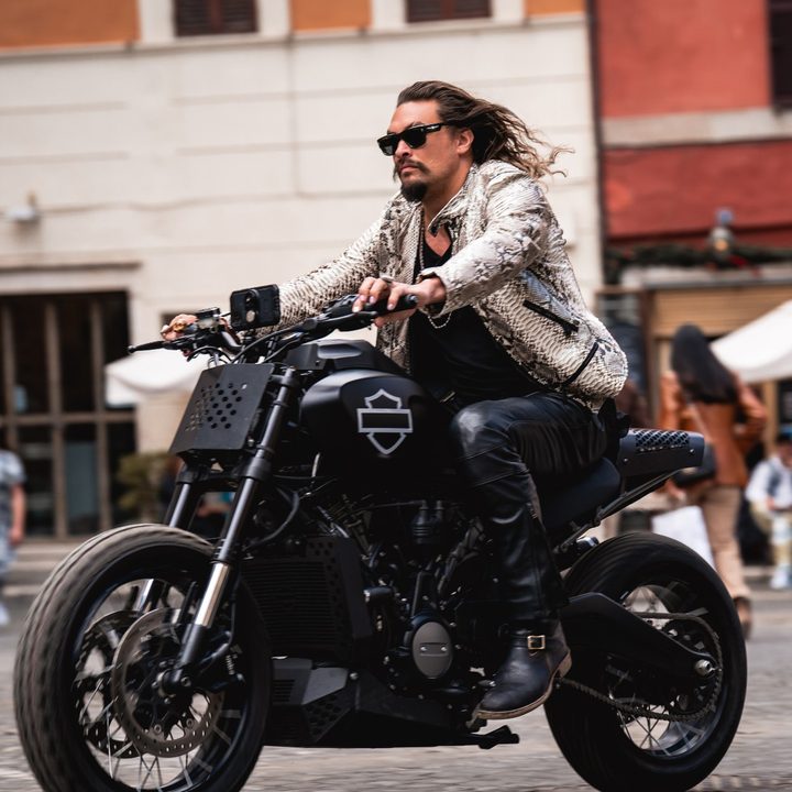 Jason Momoa rides a motorcycle in Fast X.