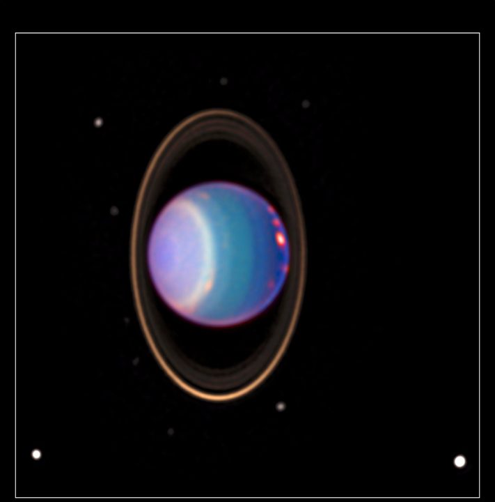 Uranus is surrounded by its four major rings and 10 of its 27 known moons in this color-added view that uses data taken by the Hubble Space Telescope in 1998. A study featuring new modeling shows that four of Uranus’ large moons likely contain internal oceans.