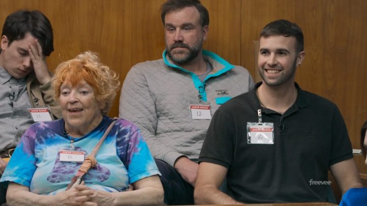 Four jurors sit in a jury box in Jury Duty.