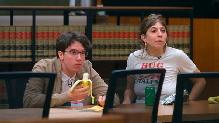 A man eats a banana with a woman in Jury Duty.