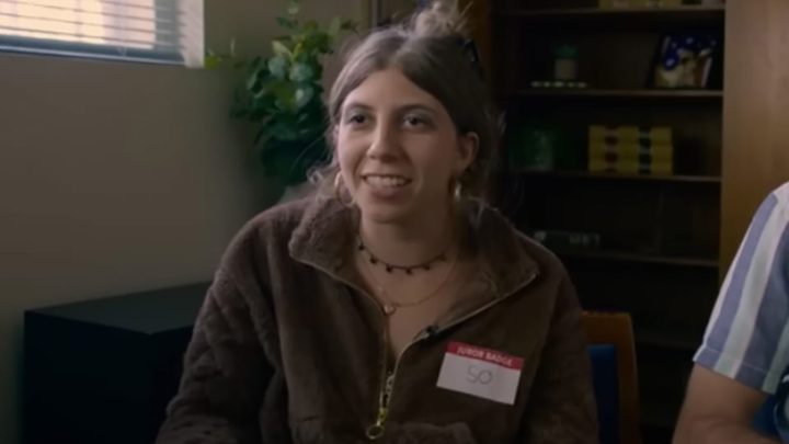 Jeannie from Jury Duty smiling and talking about the trial to the documentary maker.