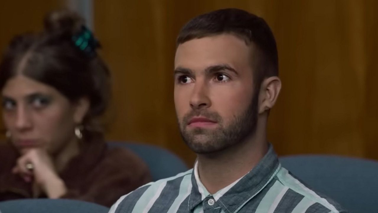 Ronald Gladden from Jury Duty sitting on the jury, listening to testimony and looking bewildered.