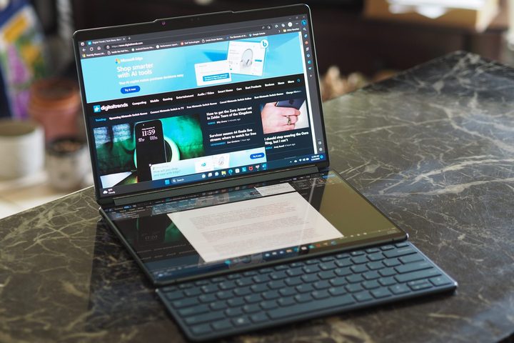 Lenovo Yoga Book 9i front view showing displays and external keyboard.