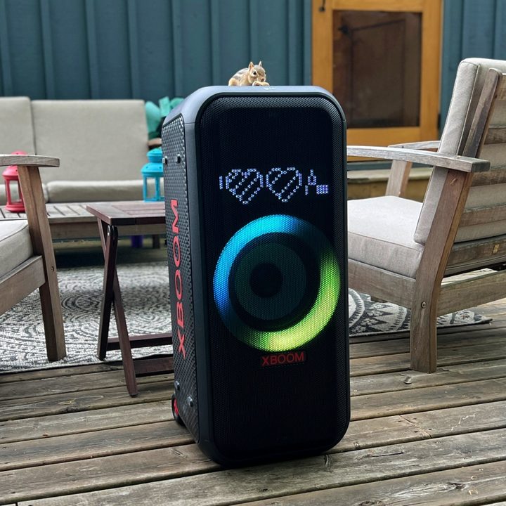 The LG XBoom XL7 portable party speaker on a table on a wooden deck.