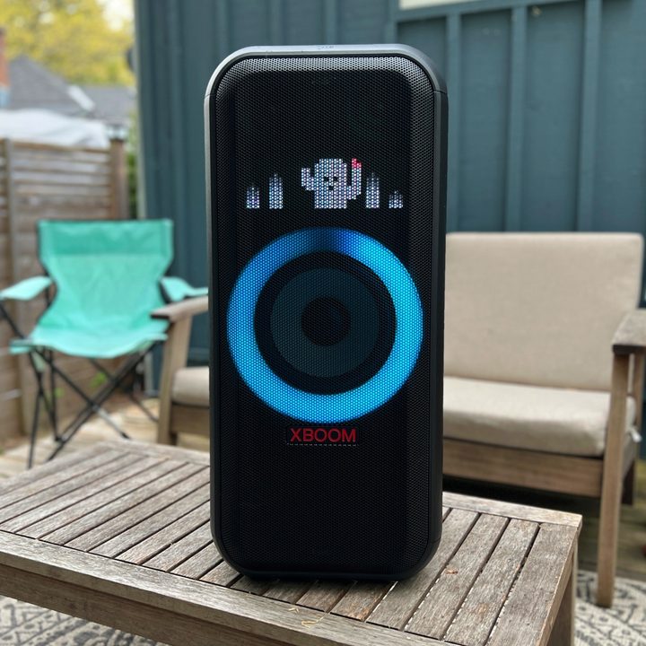 The LG XBoom XL7 portable party speaker on a table outdoors on a deck.