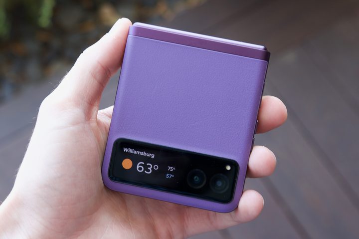 Someone holding the purple Motorola Razr (2023).