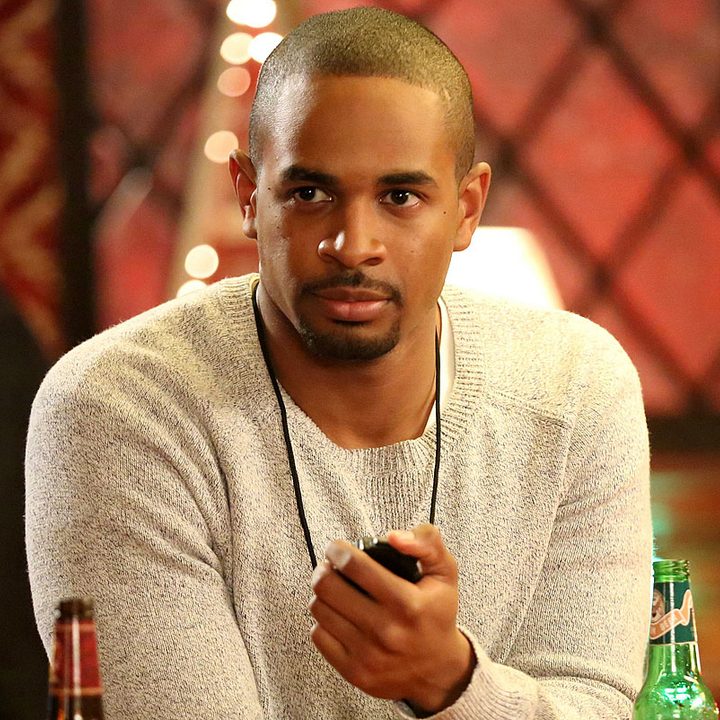 Coach sits at the bar with a stop watch in New Girl