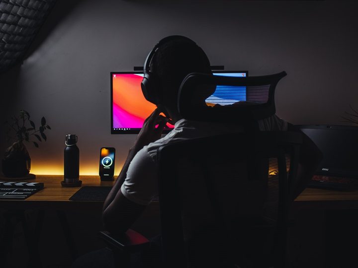 Gaming streamer working on desktop editing content.