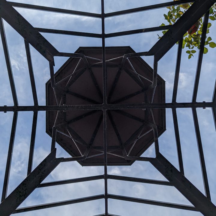 Metal canopy with sky peeking through taken with Google Pixel 6a main camera