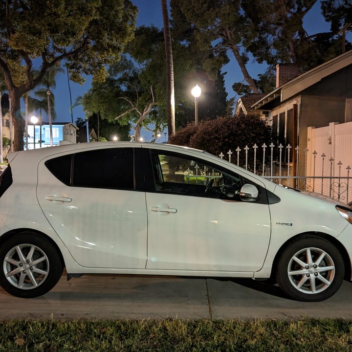 Side view of a Toyota Prius C in driveway taken with Google Pixel 6a Night Sight