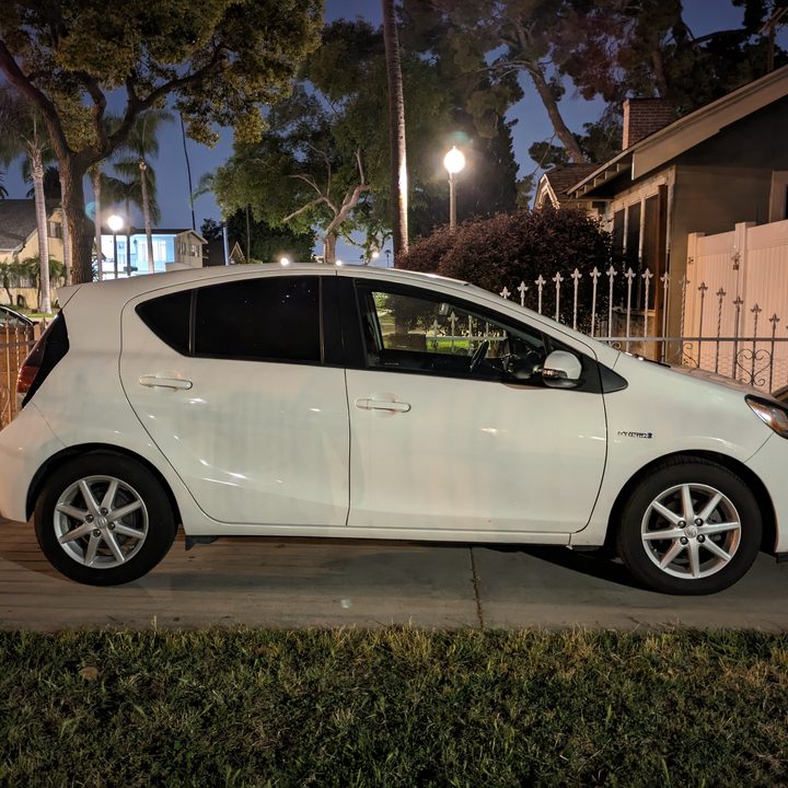 Side view of Toyota Prius C in driveway taken with Google Pixel 7a night sight