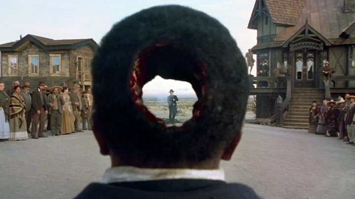 A man is shot in the head in The Quick and the Dead.
