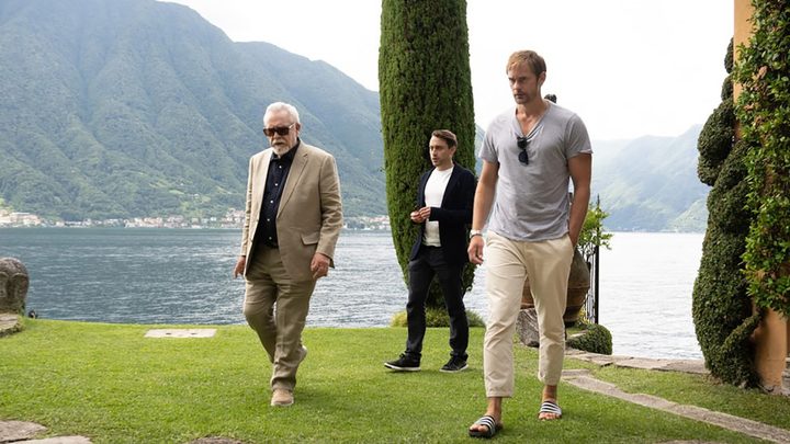 Logan Roy, Lukas Mattson, and Roman Roy walking outside in a scene from Succession.