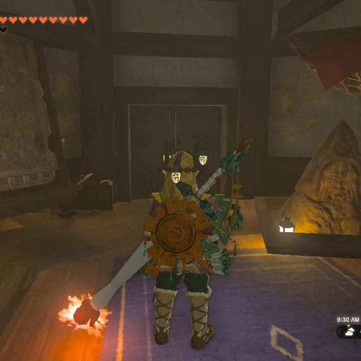 Link stands in front of a Bargainer's Statue in The Legend of Zelda: Tears of the Kingdom.