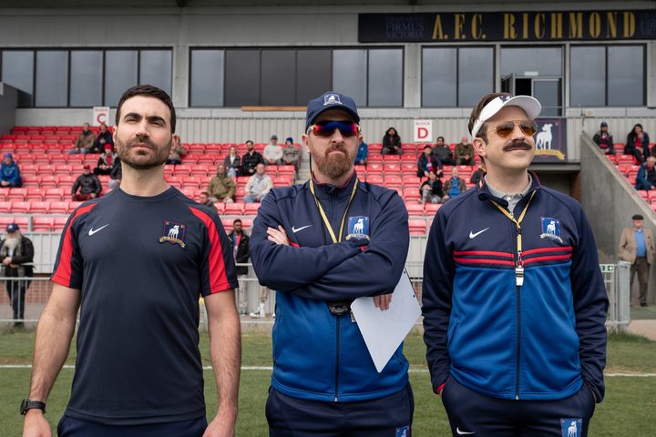 Three men stand on a field in "Ted Lasso" season 3.