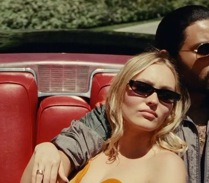 The Weeknd and Lily-Rose Depp lounge in a car in The Idol.