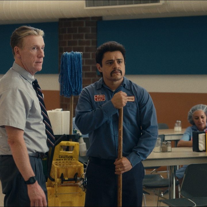A janitor stands next to his boss in Flamin' Hot.