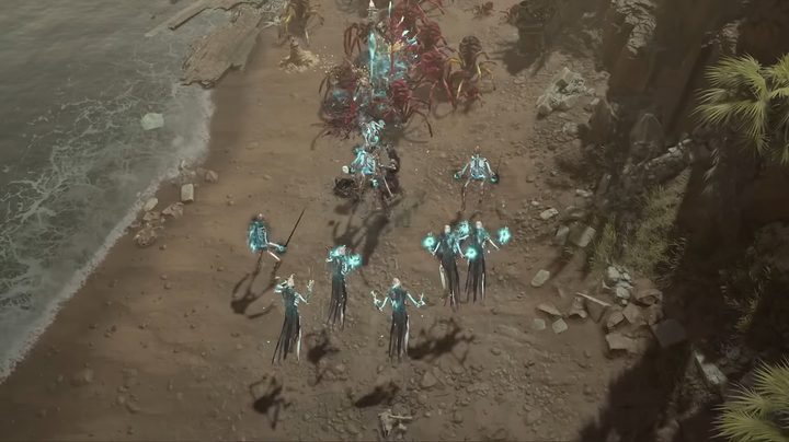 A necromancer and army of dead fighting on a beach.