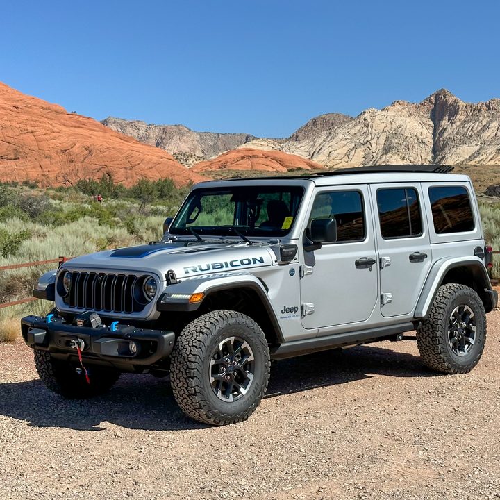 Jeep Wrangler 4xe on dirt.