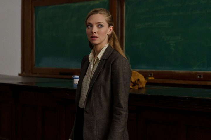 Amanda Seyfried stands near a green chalkboard in The Crowded Room.