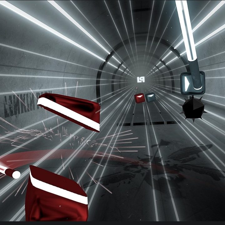 A shot from Beat Saber's Linkin Park pack, with two blocks being cut in half by the saber.