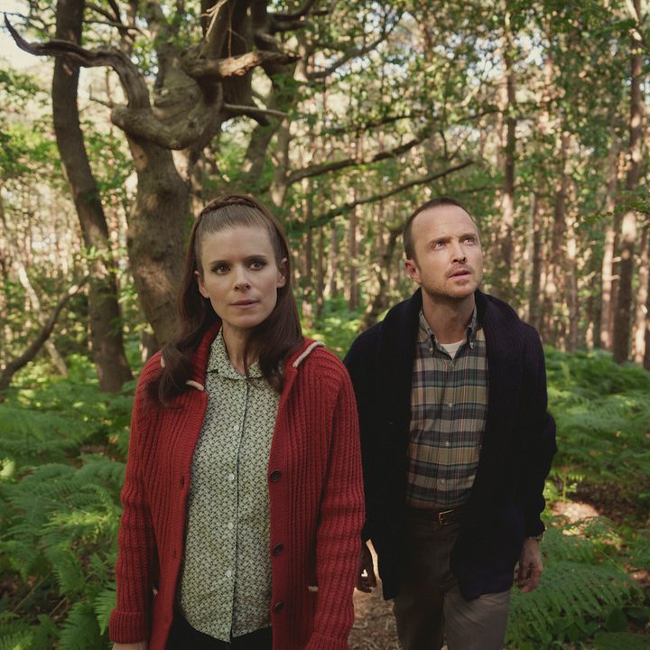 Kate Mara and Aaron Paul walk in a forest in Black Mirror.