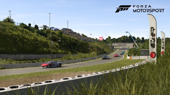Cars race on a track in Forza Motorsport