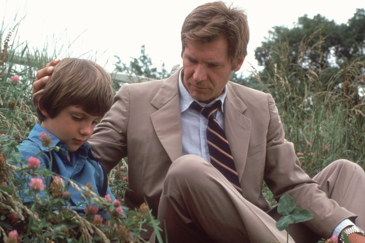 Harrison Ford holds Samuel's head in Witness.