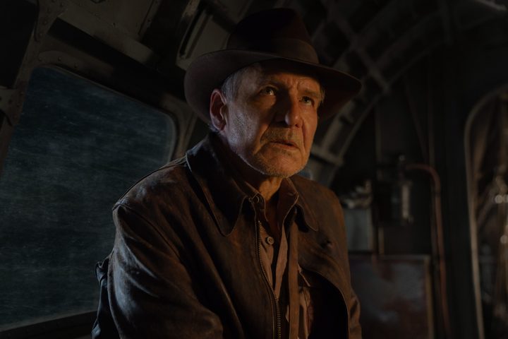 Harrison Ford sits in an airplane in Indiana Jones and the Dial of Destiny.