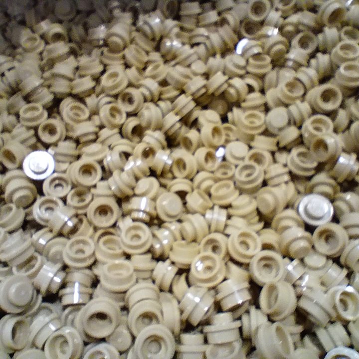 A blurry image of small LEGO pieces taken using the Moto G 5G's macro camera.