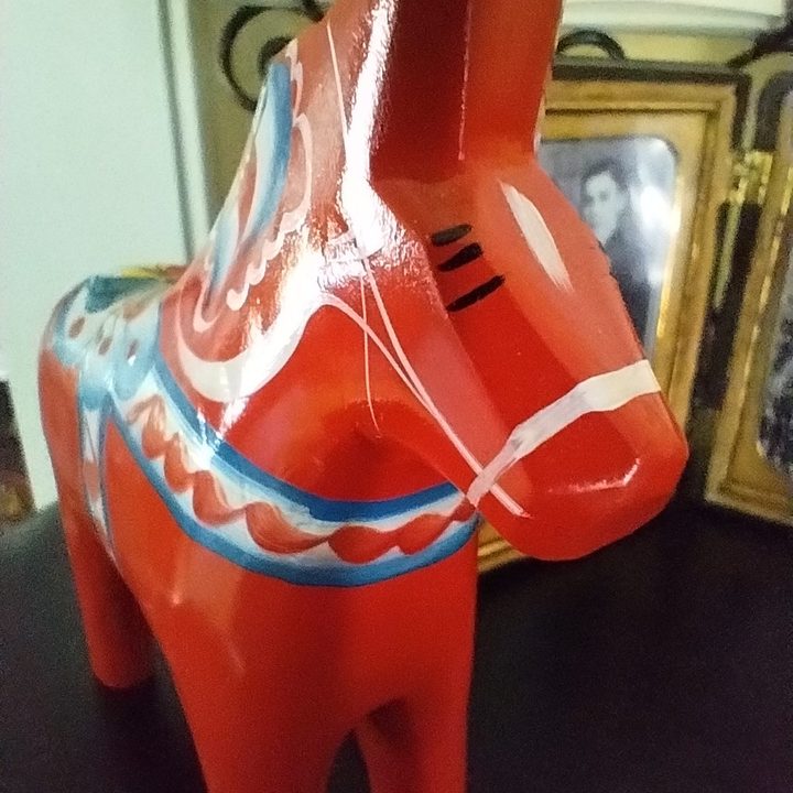 A semi-blurry image of a wooden Dala horse taken using the Moto G 5G's macro camera.