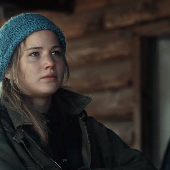 Jennifer Lawrence as Ree Dolly leaning against a wooden pillar in Winter's Bone.