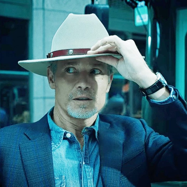 A man touches his hat in Justified: City Primeval.