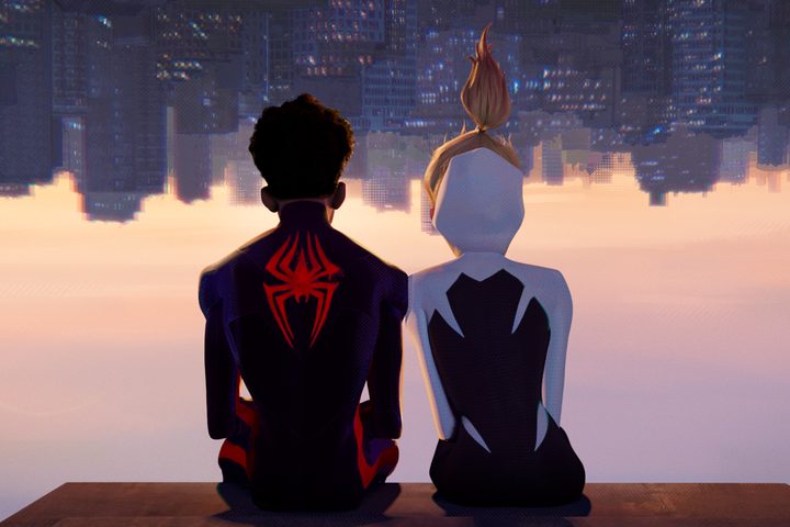 Miles Morales and Gwen Stacy hang upside down together in Spider-Man: Across the Spider-Verse.