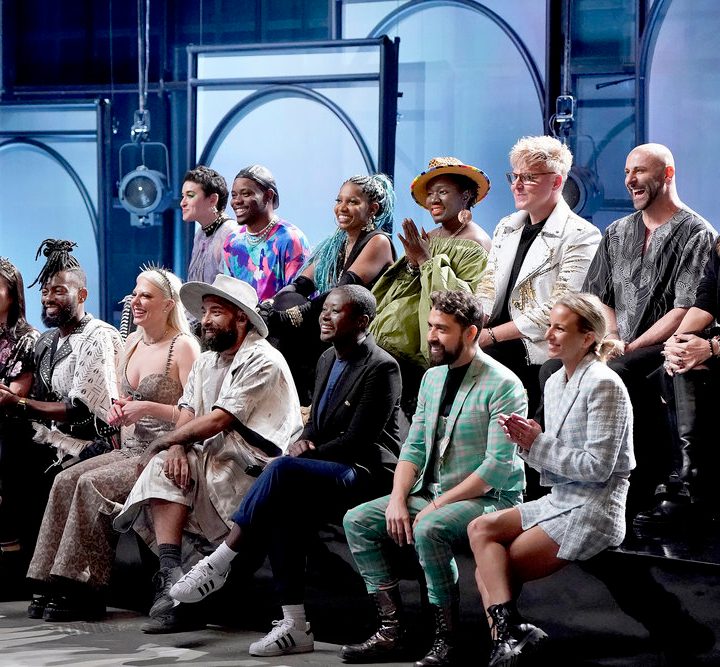 Contestants from Project Runway sit and wait to be judged.