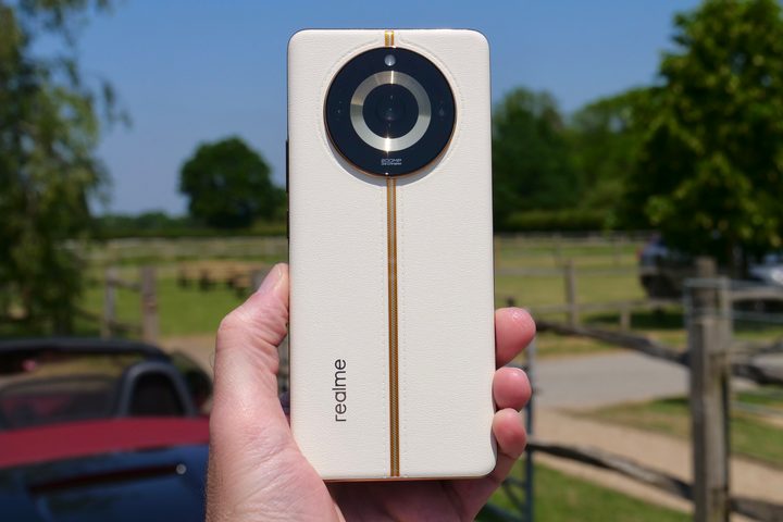 A person holding the Realme 11 Pro+.