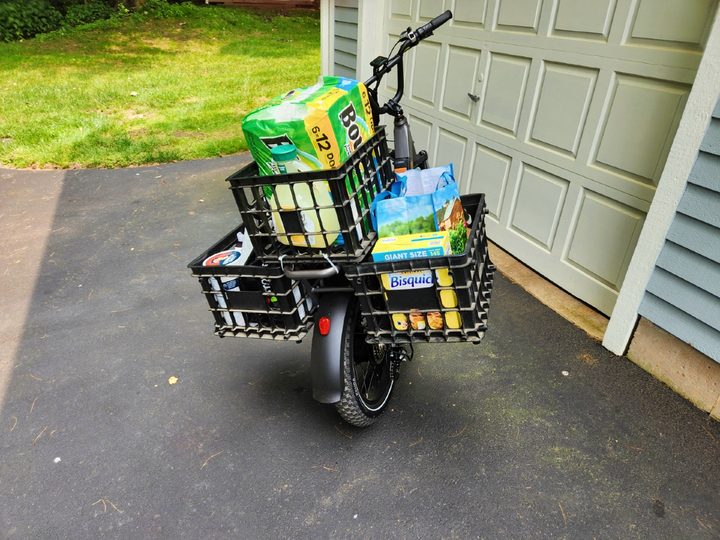 Rad Power Bikes RadRunner 3 Plus loaded from shopping with three baskets on the rear rack.