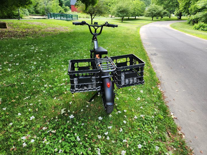 Rad Power Bikes RadRunner 3 Plus with rear view of two egg grate storage baskets attached to the rear rack.