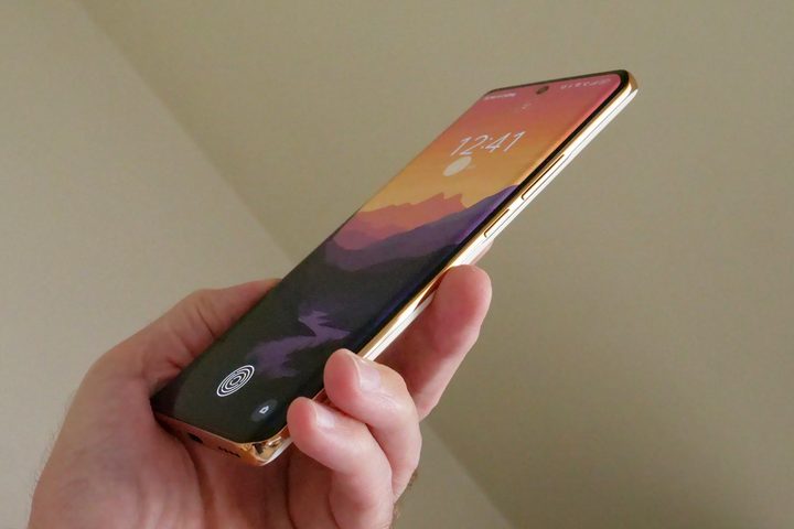 A person holding the Realme 11 Pro+, showing the side of the phone.