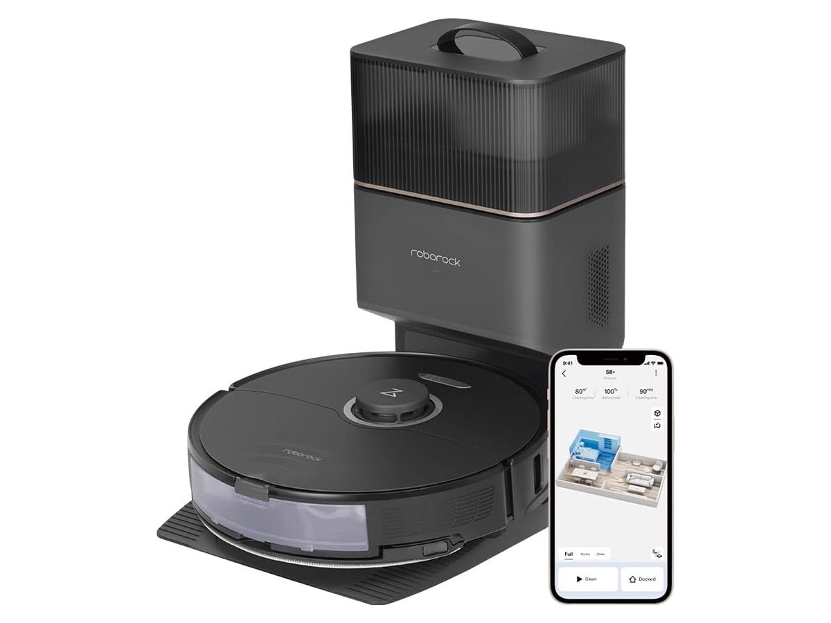 The Roborock S8+ in its docking station alongside a smartphone displaying the Roborock app.