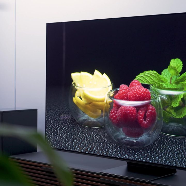 An image of bowls with lemon, raspberries, and mint displayed on a Samsung S95C.