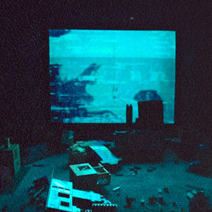 A green-tinted television screen has some spooky stuff on it.
